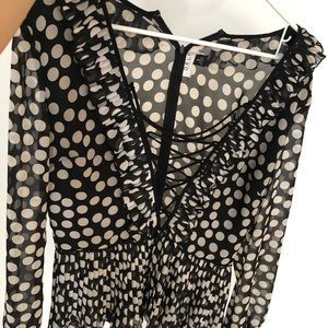 Delphi’s polka dot top with peplum pleats